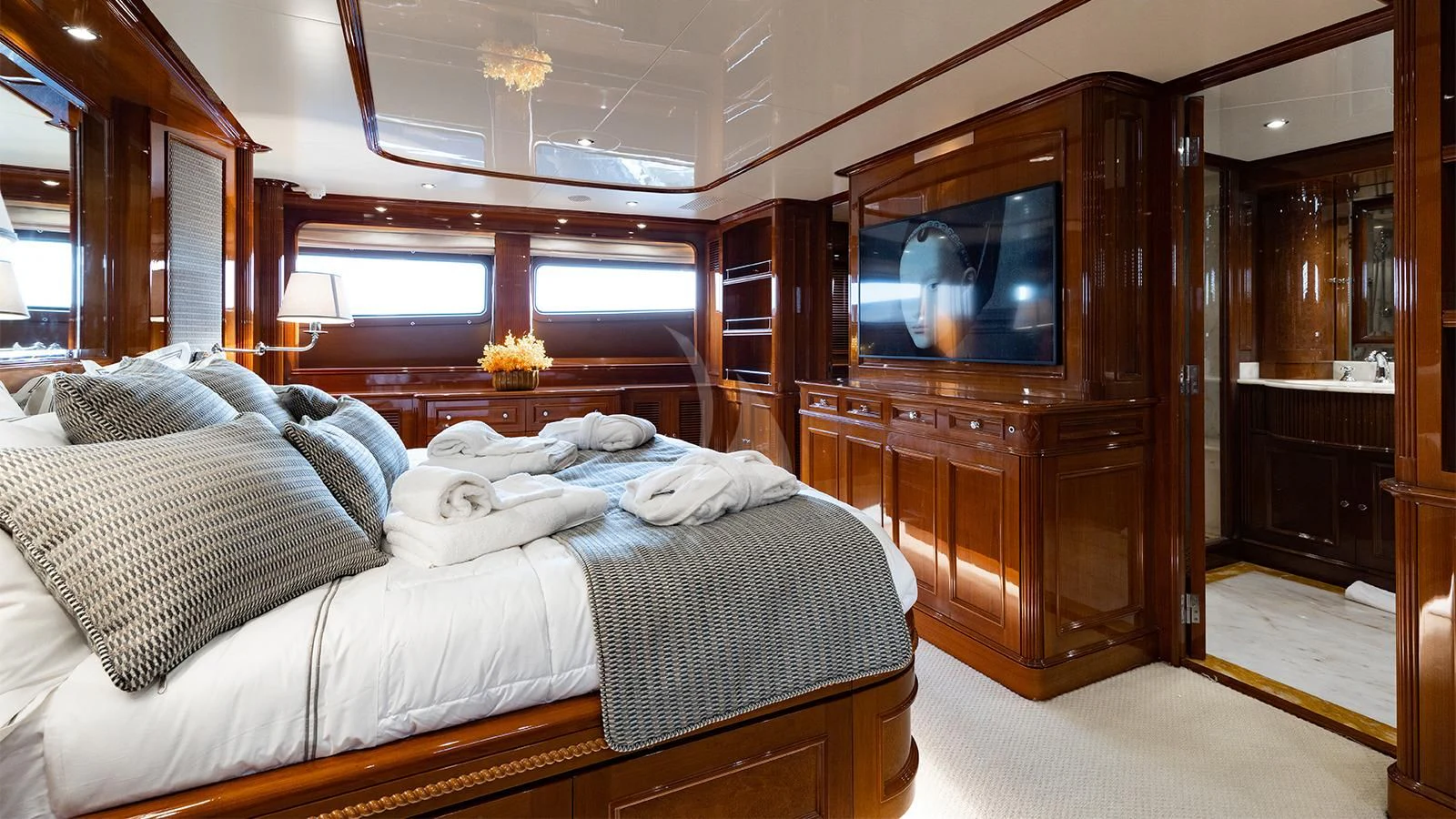 a bedroom with a large bed aboard OAK Yacht for Charter