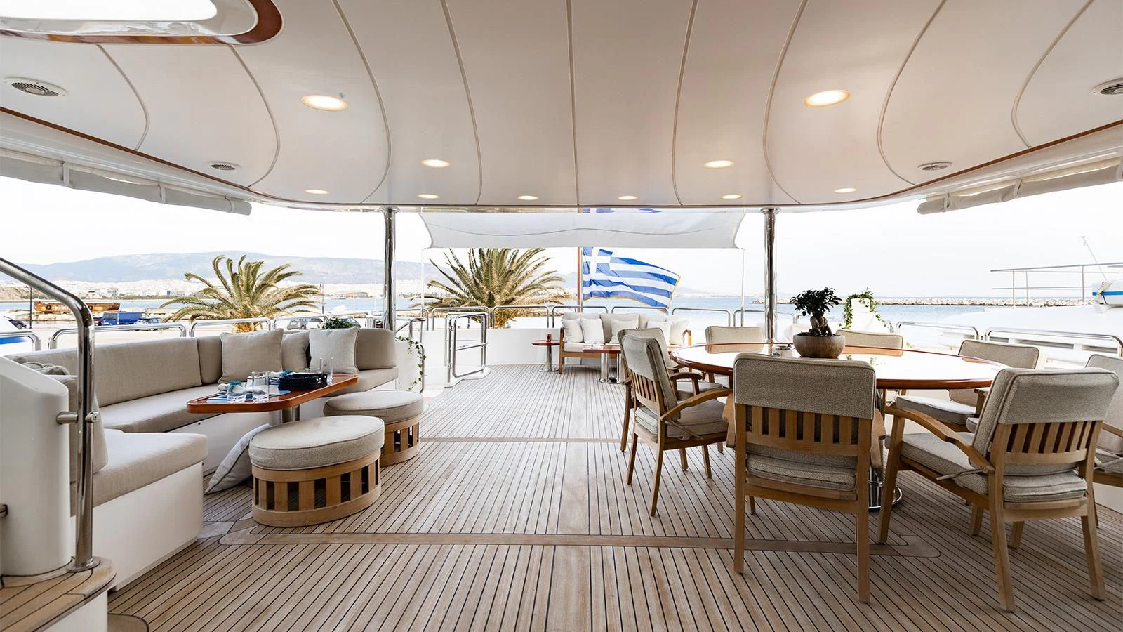 a room with tables and chairs aboard OAK Yacht for Charter