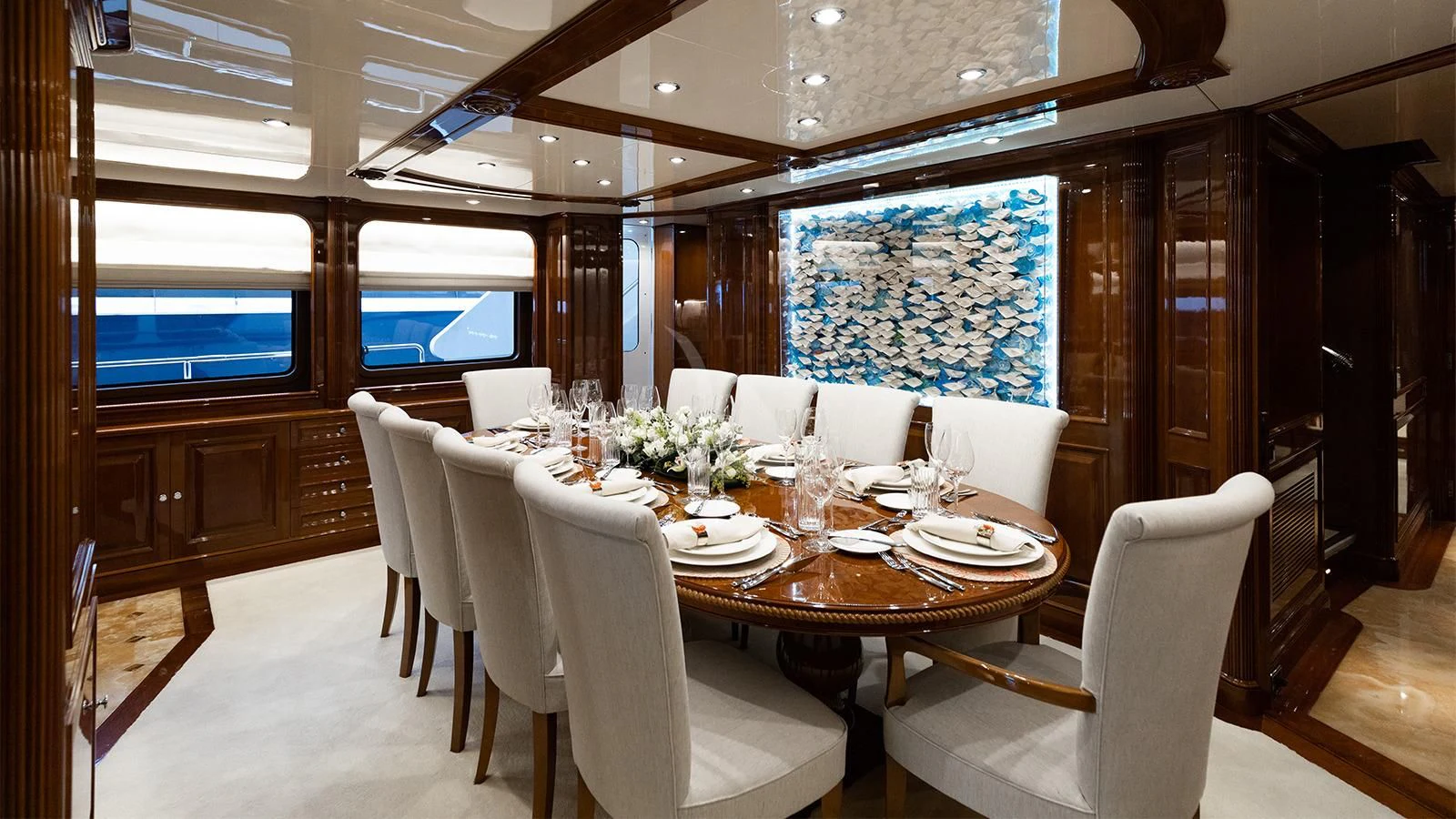 a dining room with a table and chairs aboard OAK Yacht for Charter