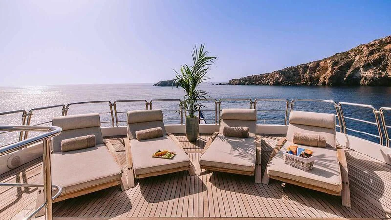 a table and chairs on a boat aboard OAK Yacht for Charter