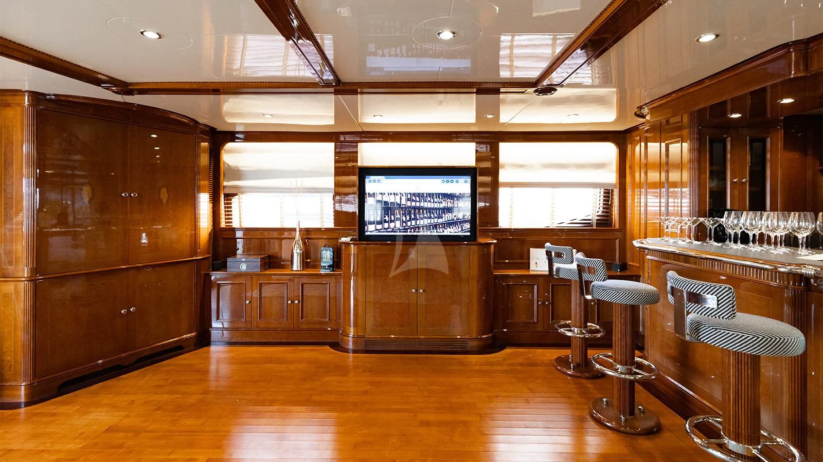 a room with a large tv aboard OAK Yacht for Charter
