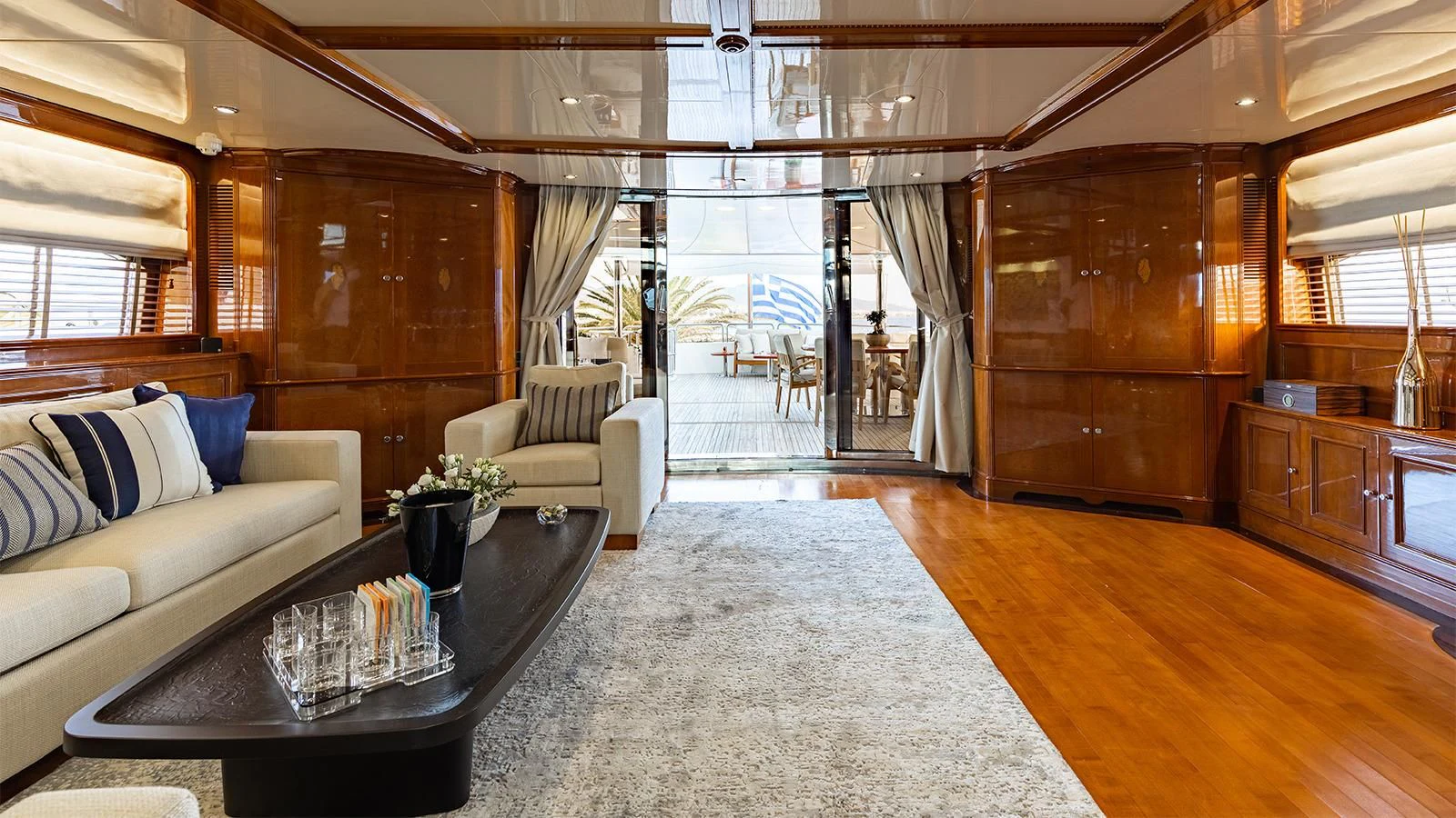 a living room with a couch and a coffee table aboard OAK Yacht for Charter