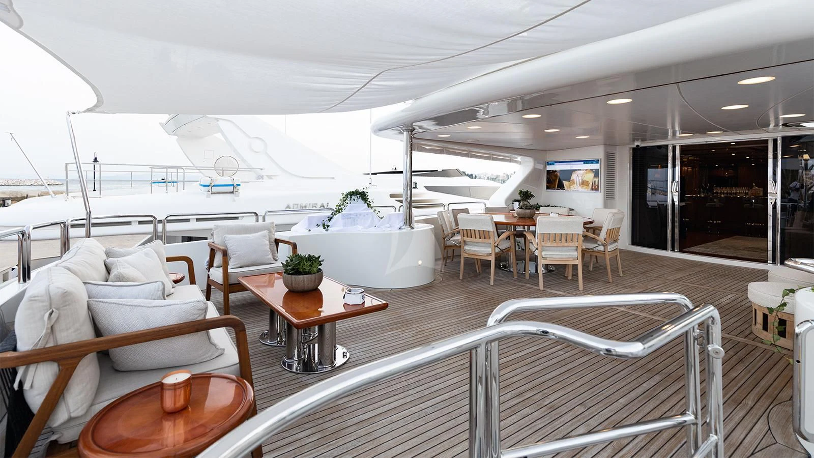 a room with a table chairs and a couch aboard OAK Yacht for Charter