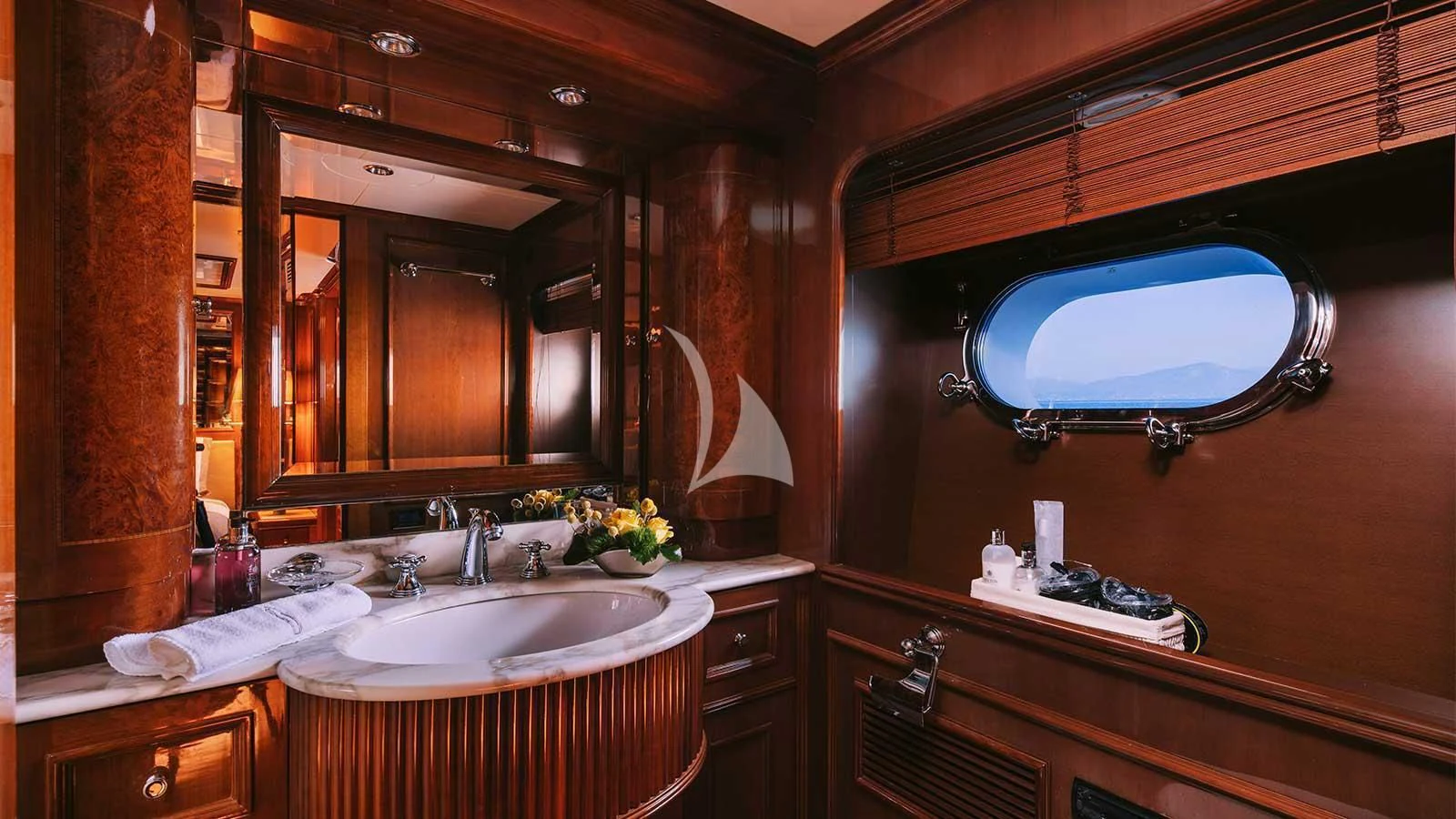 a bathroom with a large mirror aboard OAK Yacht for Charter