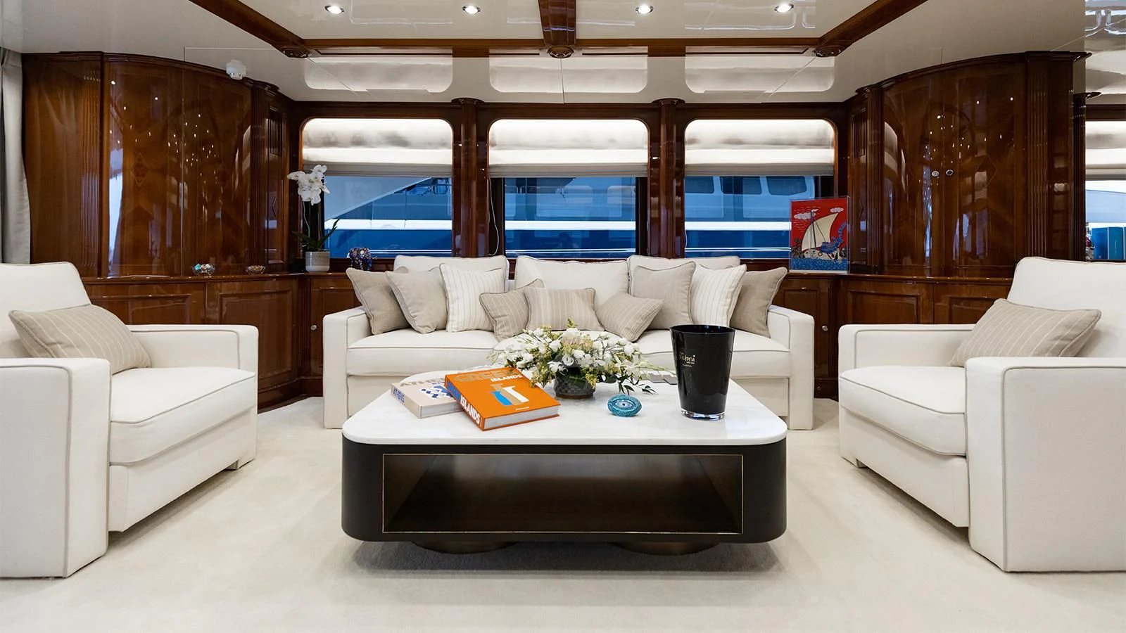 a living room with a couch and a table aboard OAK Yacht for Charter