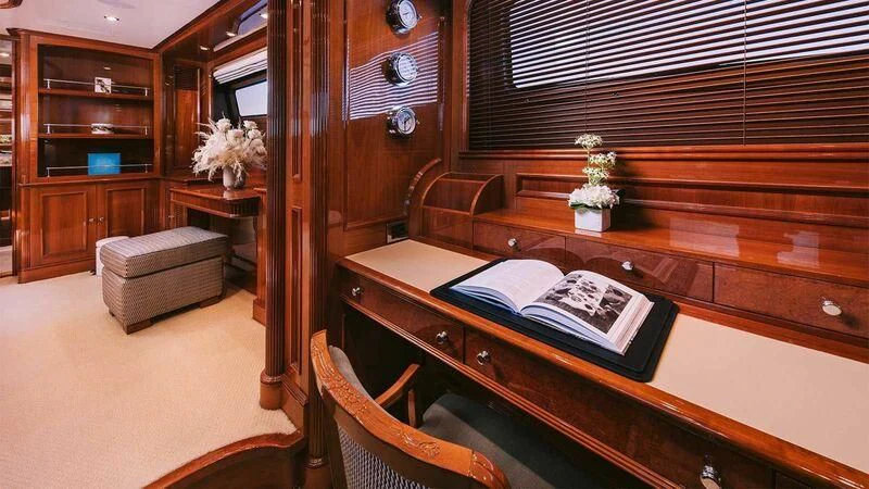 a room with a desk and a chair aboard OAK Yacht for Charter