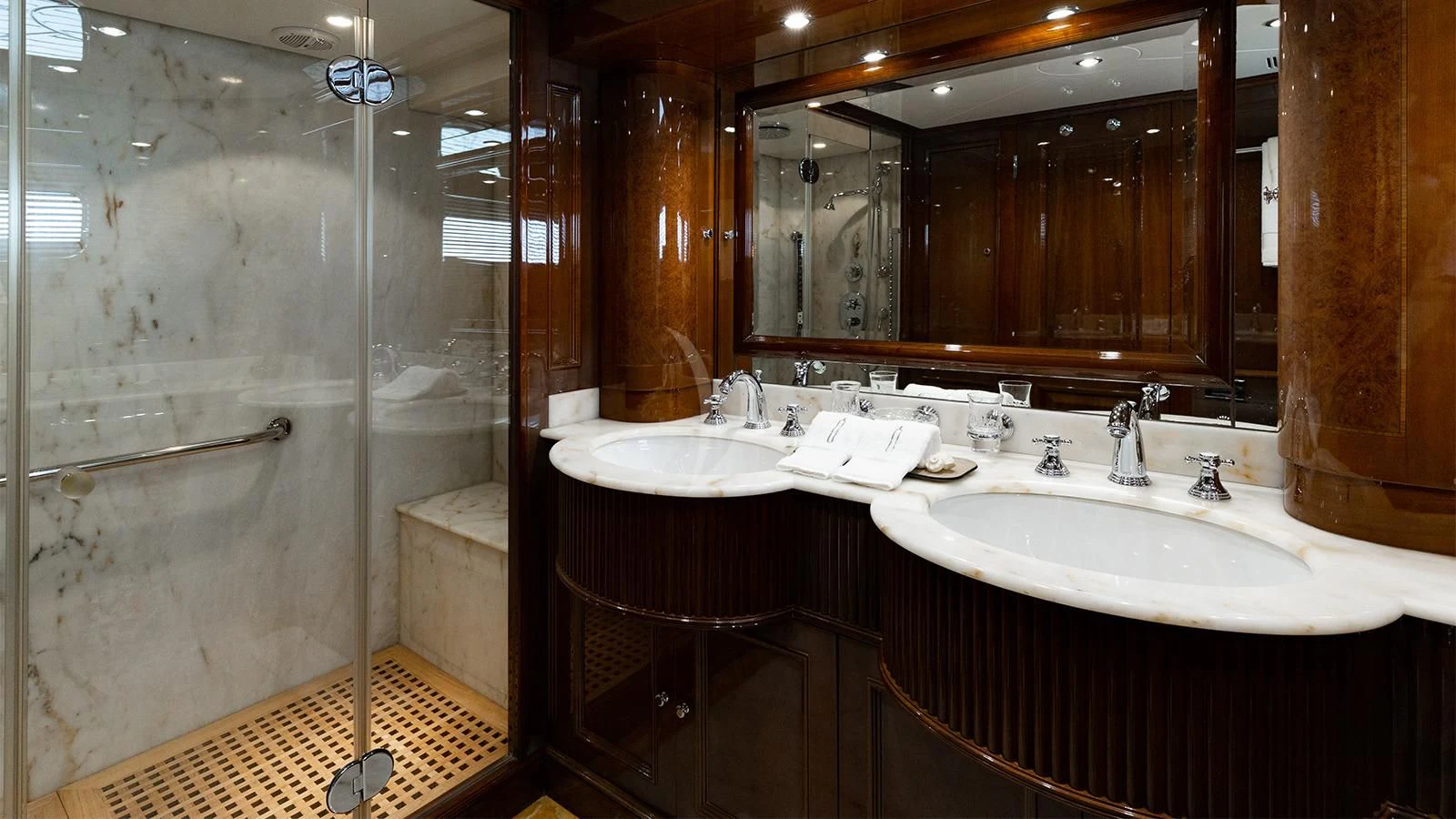 a bathroom with a large mirror aboard OAK Yacht for Charter