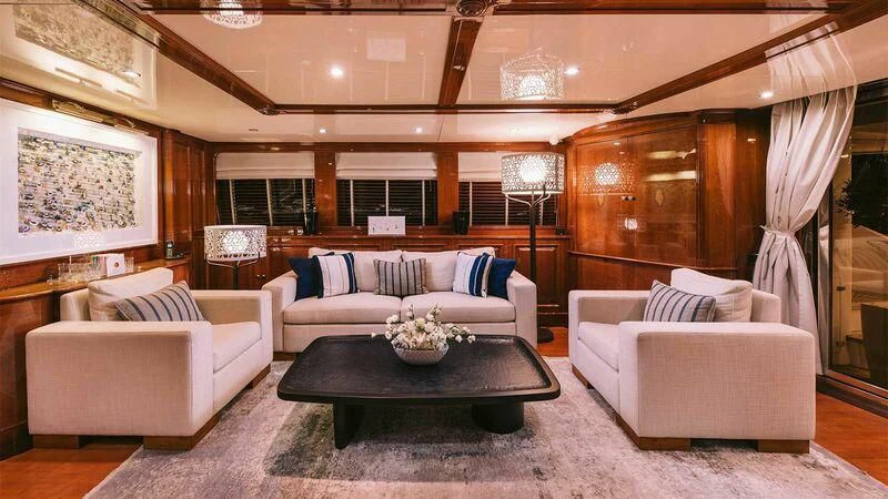 a living room with a couch and a coffee table aboard OAK Yacht for Charter