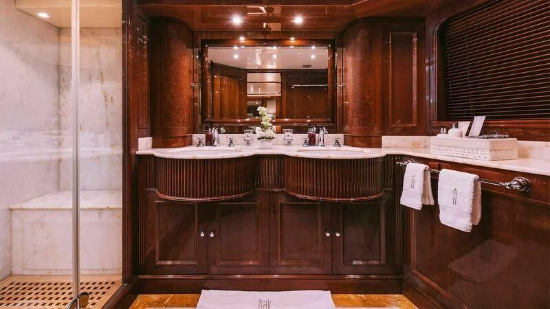 a bathroom with a sink and a mirror aboard OAK Yacht for Charter