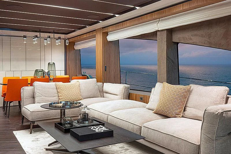 a living room with a large window aboard CRANCHI SETTANTOTTO 78/01 Yacht for Sale