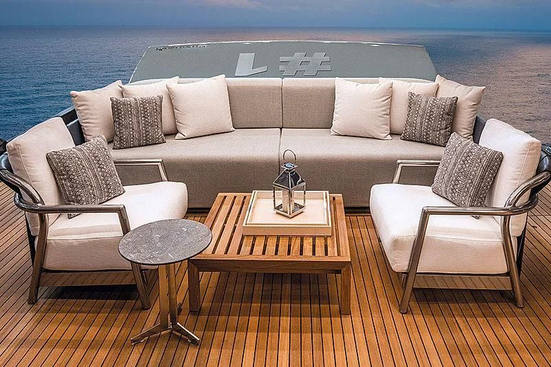 a couch and a table on a deck overlooking the ocean aboard CRANCHI SETTANTOTTO 78/01 Yacht for Sale