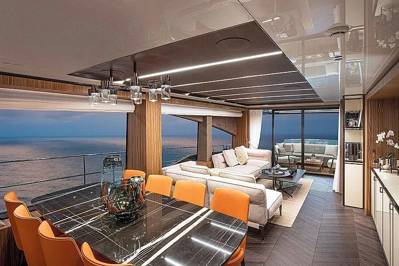 a large living room with a large balcony aboard CRANCHI SETTANTOTTO 78/01 Yacht for Sale