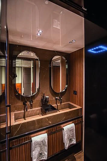 a bathroom with a large mirror aboard CRANCHI SETTANTOTTO 78/01 Yacht for Sale