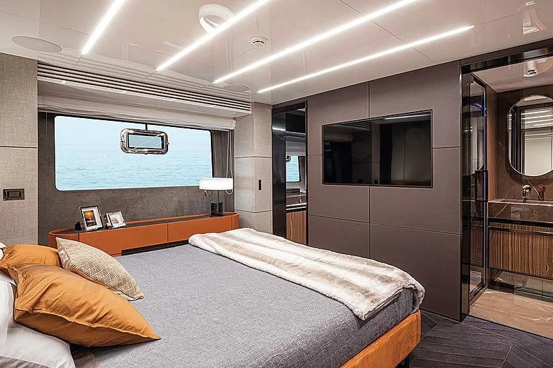 a bedroom with a bed and a television aboard CRANCHI SETTANTOTTO 78/01 Yacht for Sale