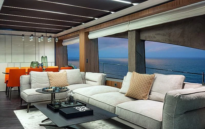 a living room with a large window aboard CRANCHI SETTANTOTTO 78/01 Yacht for Sale