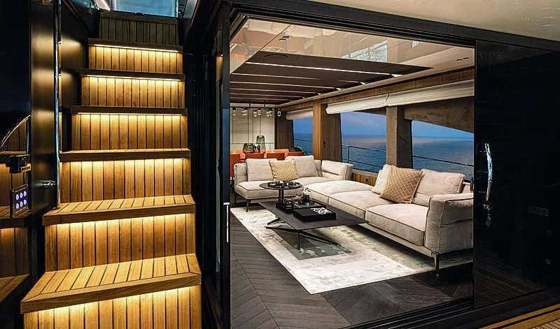 a room with a couch and a table aboard CRANCHI SETTANTOTTO 78/01 Yacht for Sale