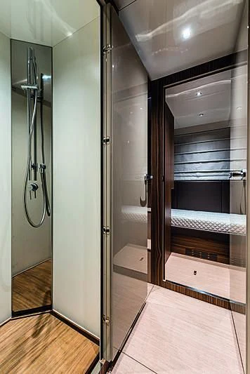 a large bathroom with a glass shower aboard CRANCHI SETTANTOTTO 78/01 Yacht for Sale