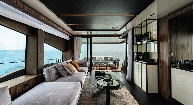 a living room with a large window aboard CRANCHI SETTANTOTTO 78/01 Yacht for Sale