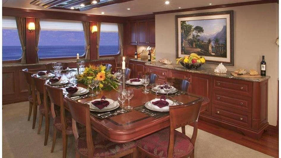a dining table in a kitchen aboard STARGAZER Yacht for Sale
