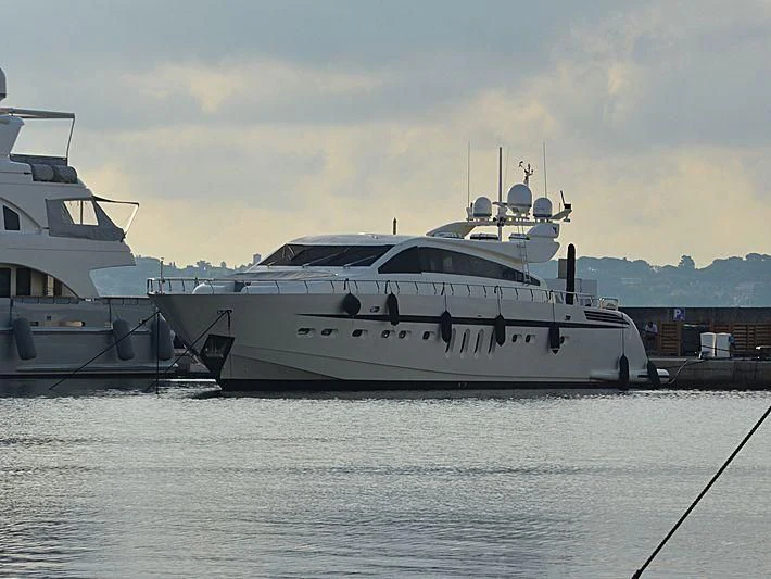 a couple of boats sit in a harbor aboard LA ROMANA Yacht for Sale