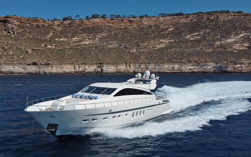 a white yacht on the water aboard LA ROMANA Yacht for Sale