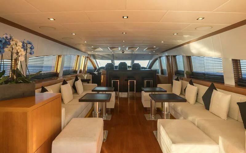 a large room with couches and tables aboard LA ROMANA Yacht for Sale