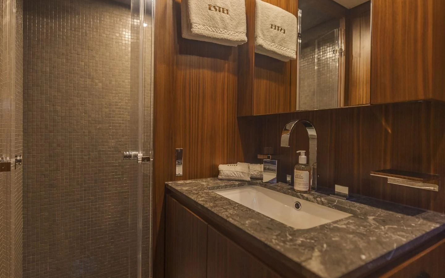 a bathroom with a countertop sink and a mirror aboard LA ROMANA Yacht for Sale