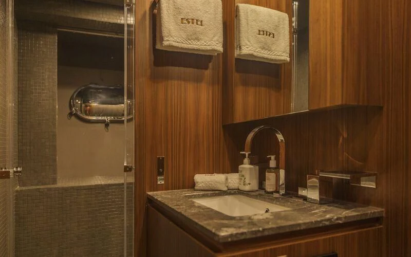 a bathroom with a sink and a mirror aboard LA ROMANA Yacht for Sale
