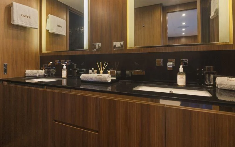 a kitchen counter with a bottle of liquor on it aboard LA ROMANA Yacht for Sale