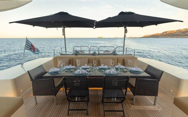 a table set for a meal on a boat aboard LA ROMANA Yacht for Sale