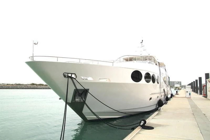 a white boat on a dock aboard ANONYMUS Yacht for Sale