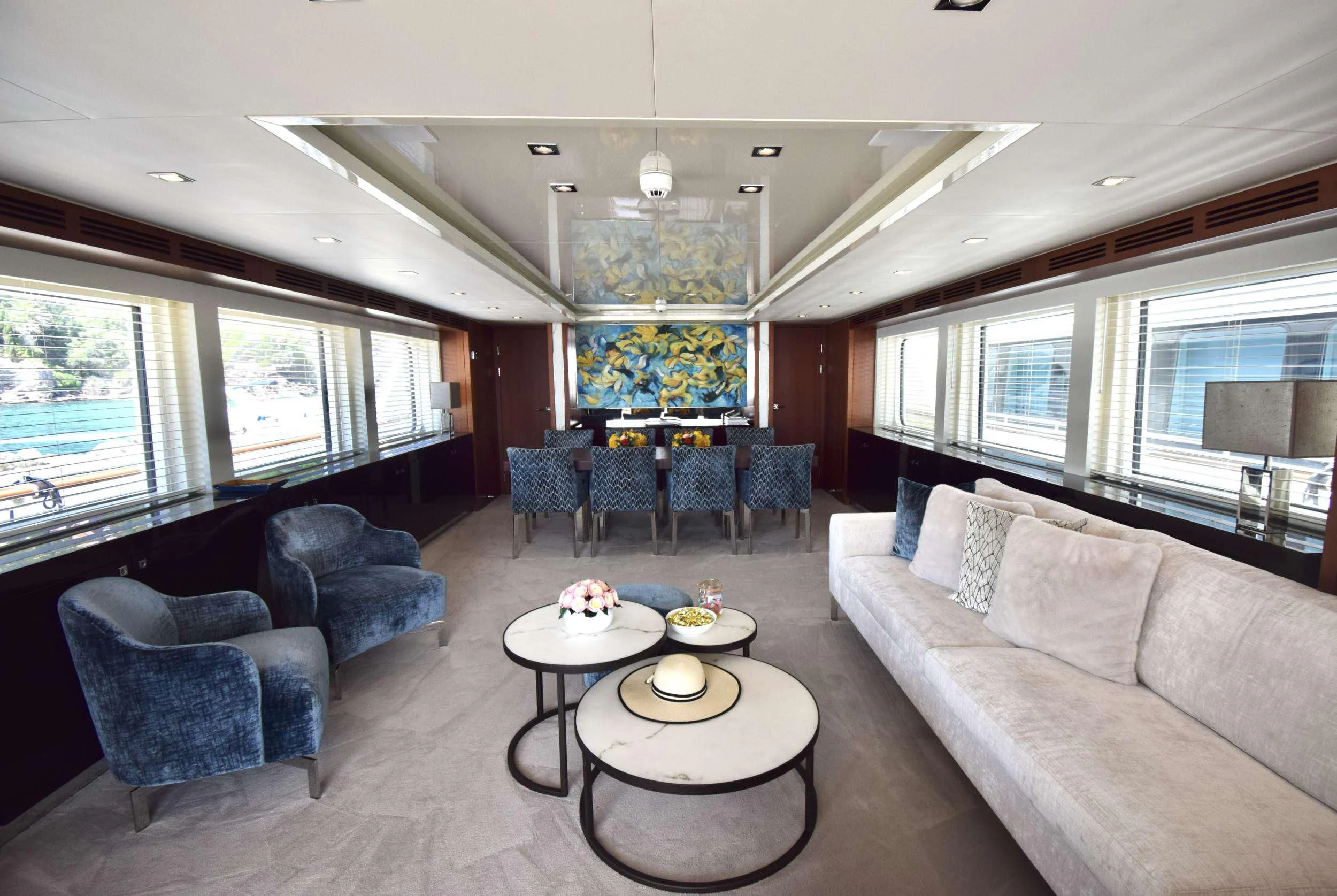 a living room with a large window aboard ORIZZONTE Yacht for Sale