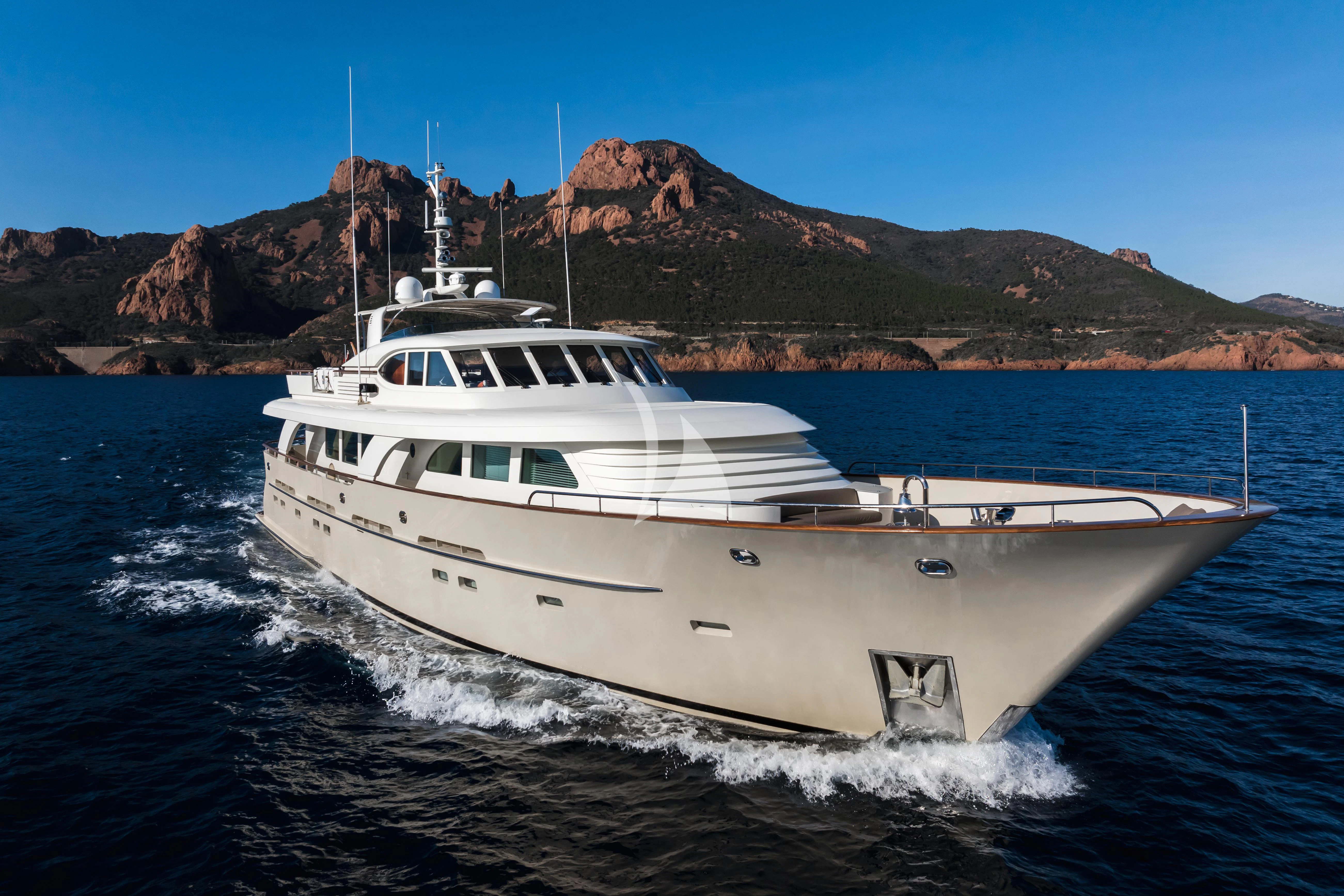 a white yacht on the water aboard ORIZZONTE Yacht for Sale