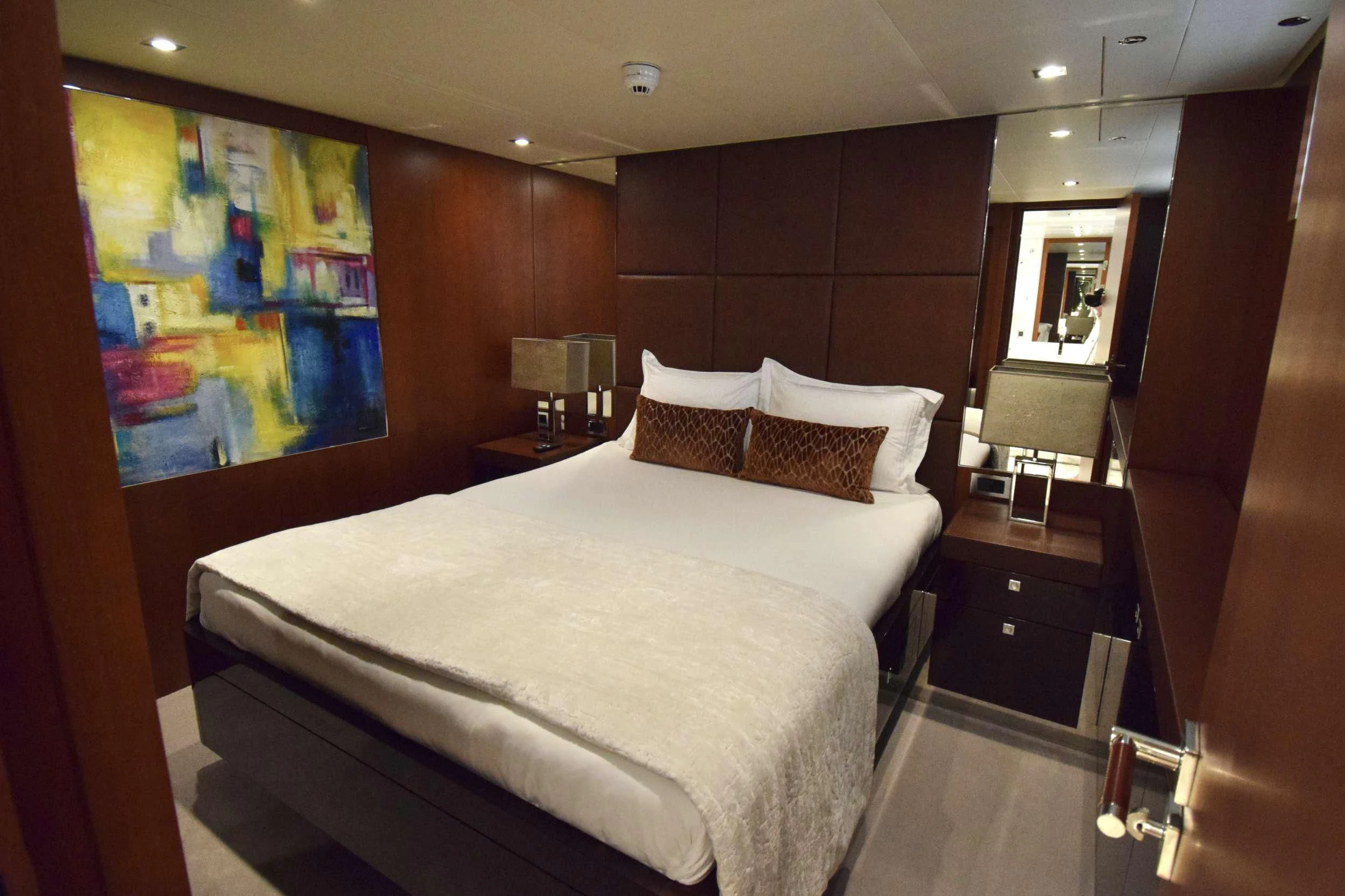 a bed in a room aboard ORIZZONTE Yacht for Sale