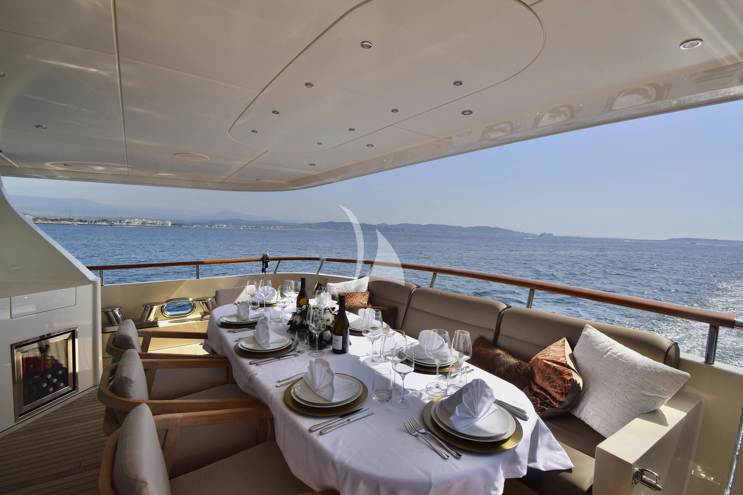 a table set for a dinner on a ship aboard ORIZZONTE Yacht for Sale