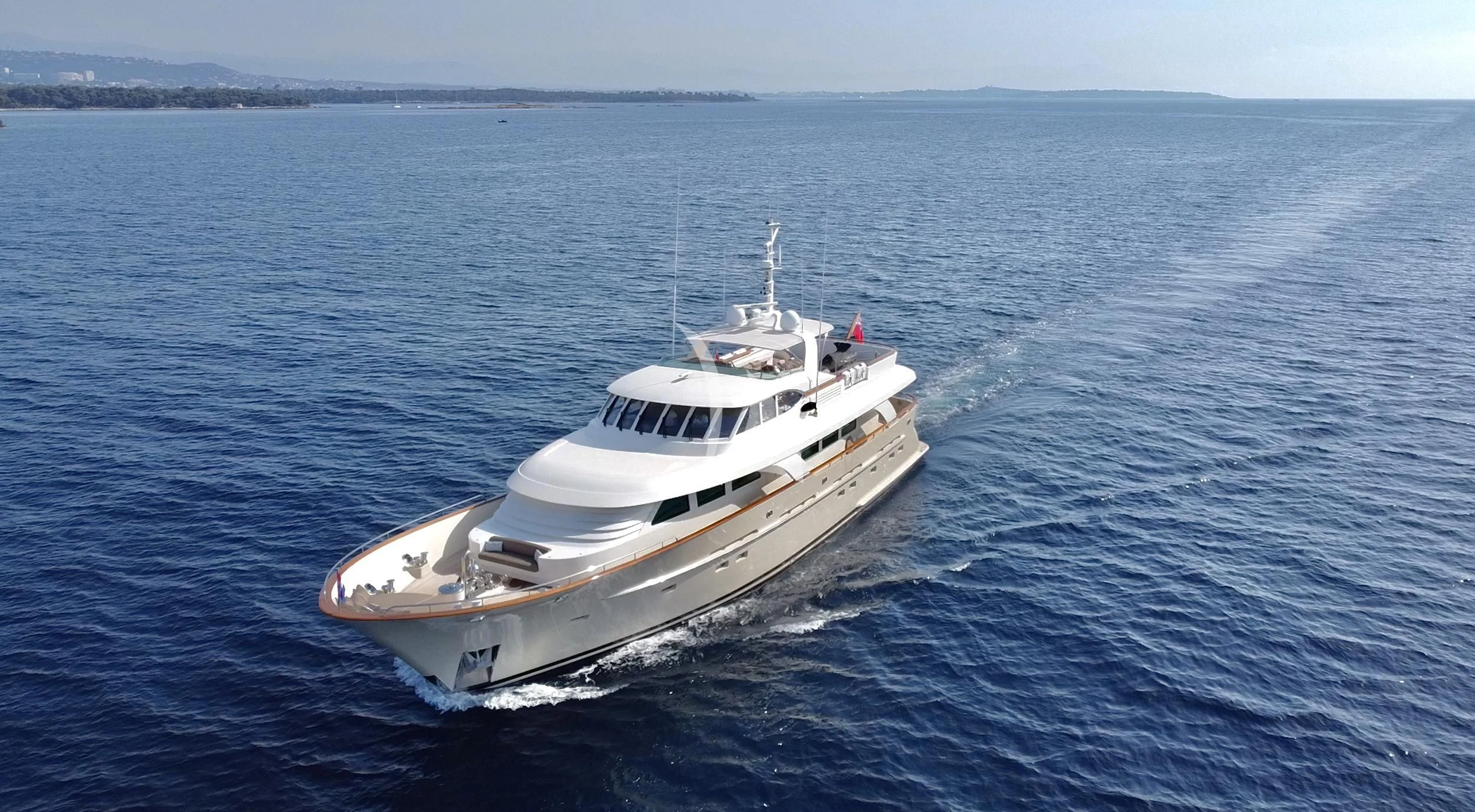 a white boat in the water aboard ORIZZONTE Yacht for Sale