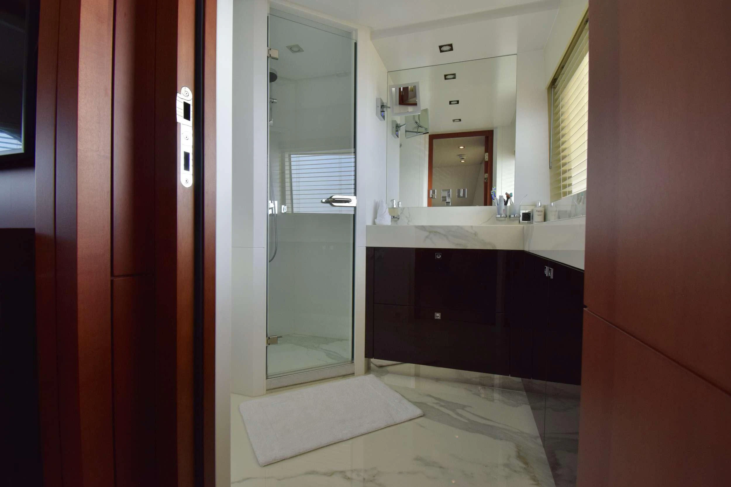 a bathroom with a sink and a mirror aboard ORIZZONTE Yacht for Sale