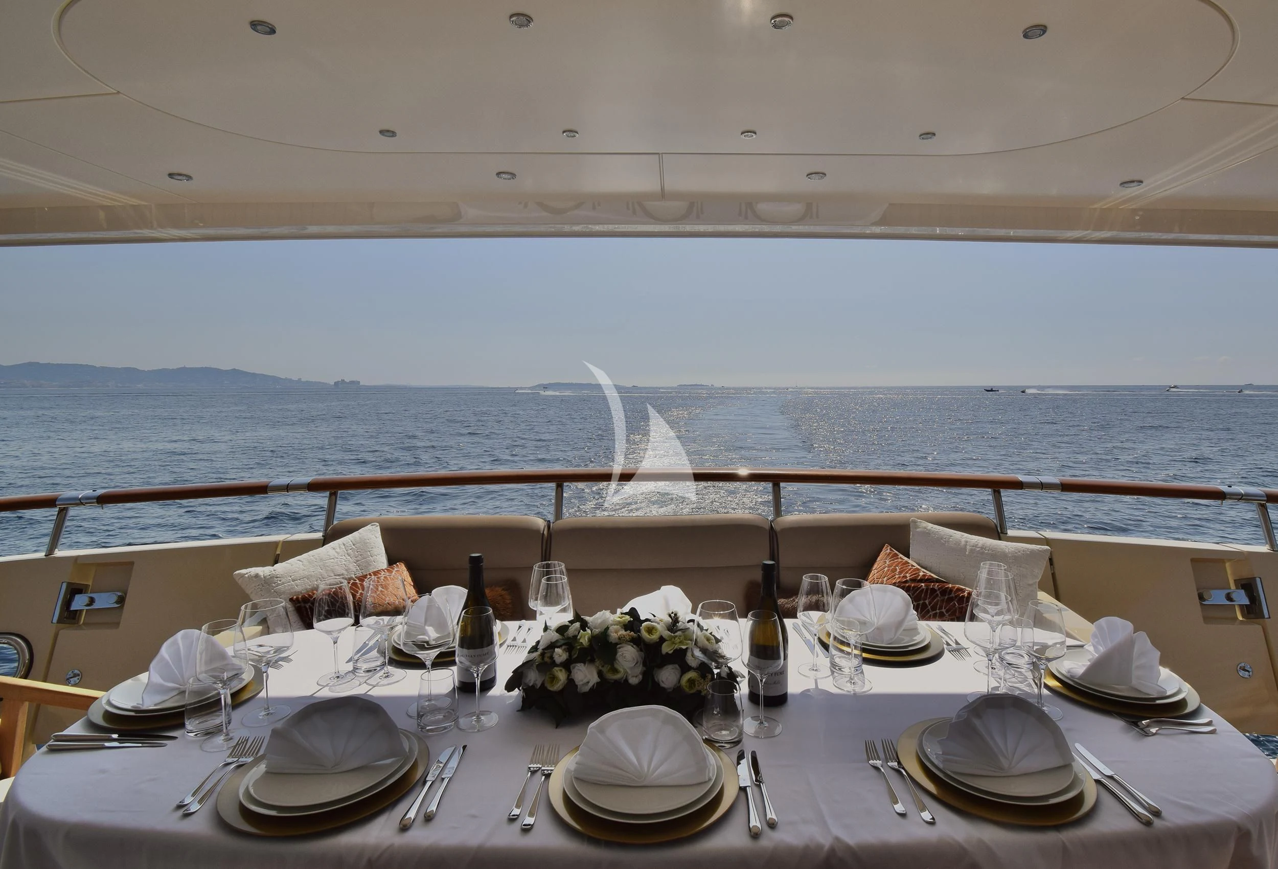 a table set for a dinner aboard ORIZZONTE Yacht for Sale