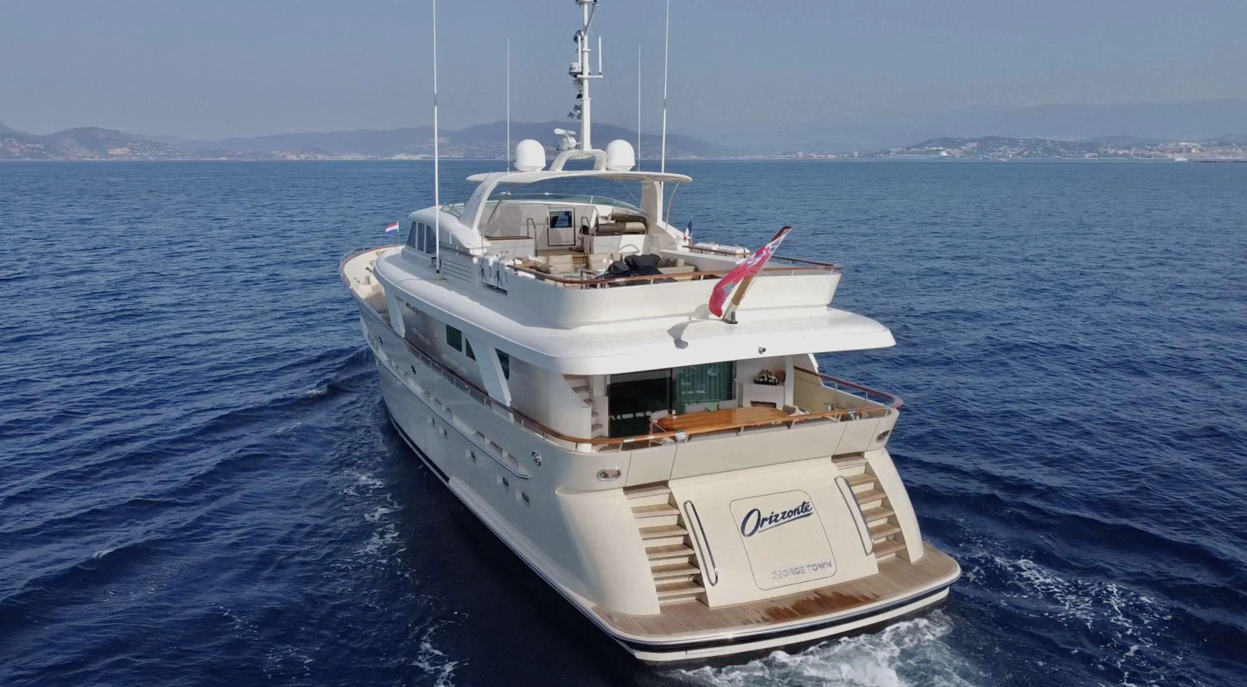 a white boat in the water aboard ORIZZONTE Yacht for Sale