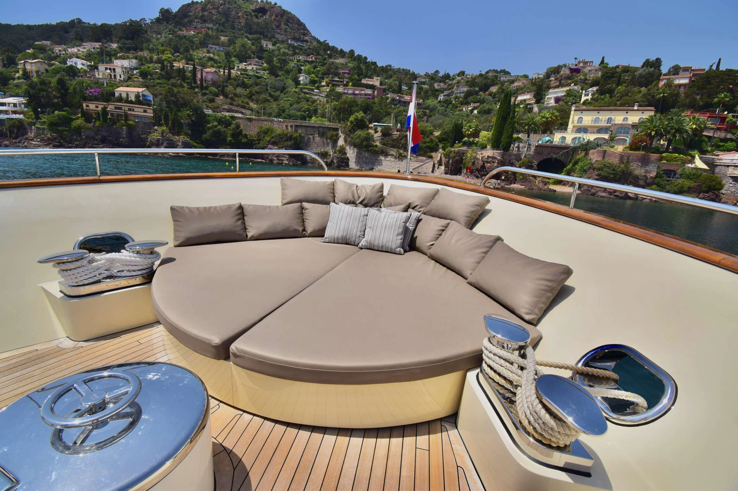 a couch on a table aboard ORIZZONTE Yacht for Sale