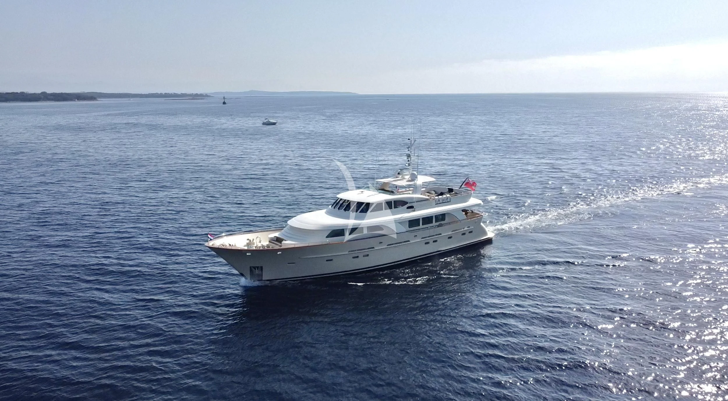a white yacht in the water aboard ORIZZONTE Yacht for Sale