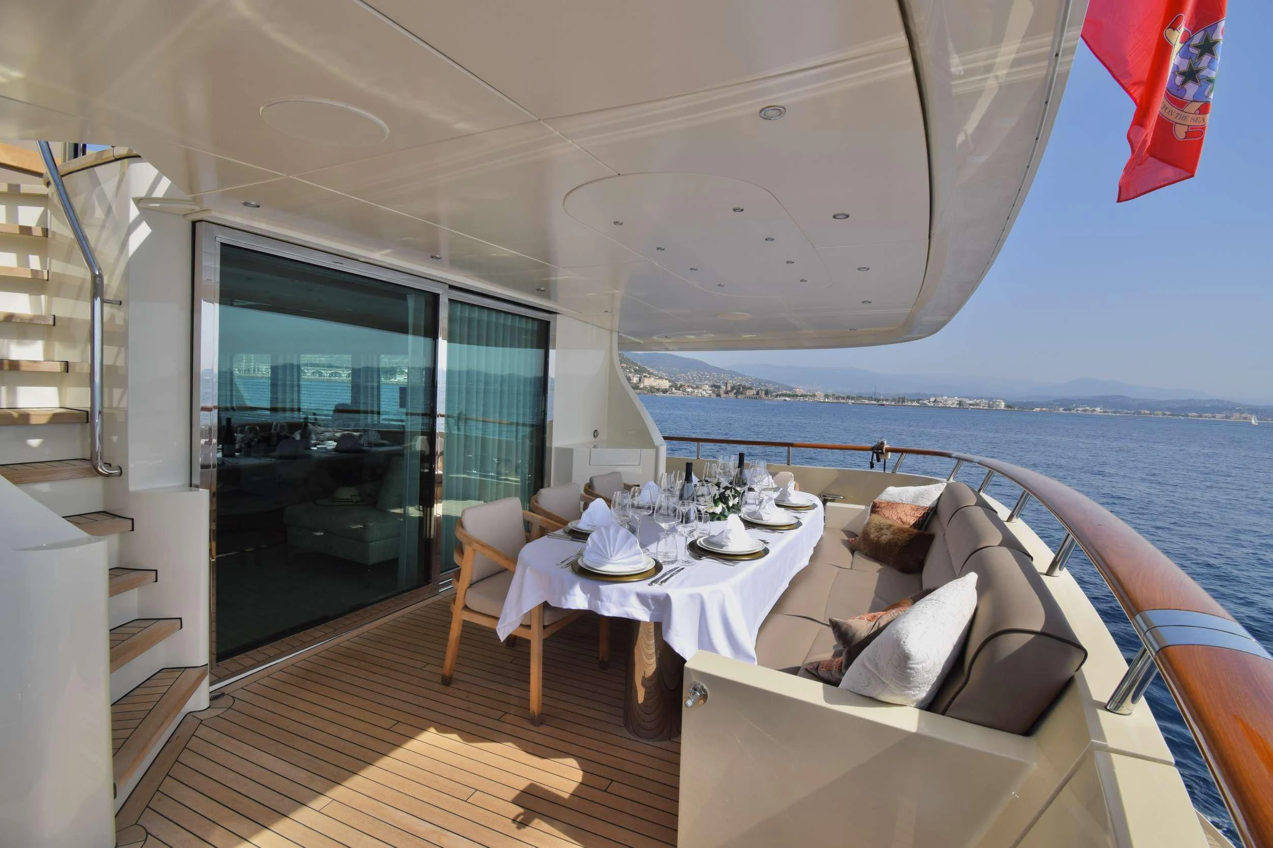 a boat with a table and chairs aboard ORIZZONTE Yacht for Sale