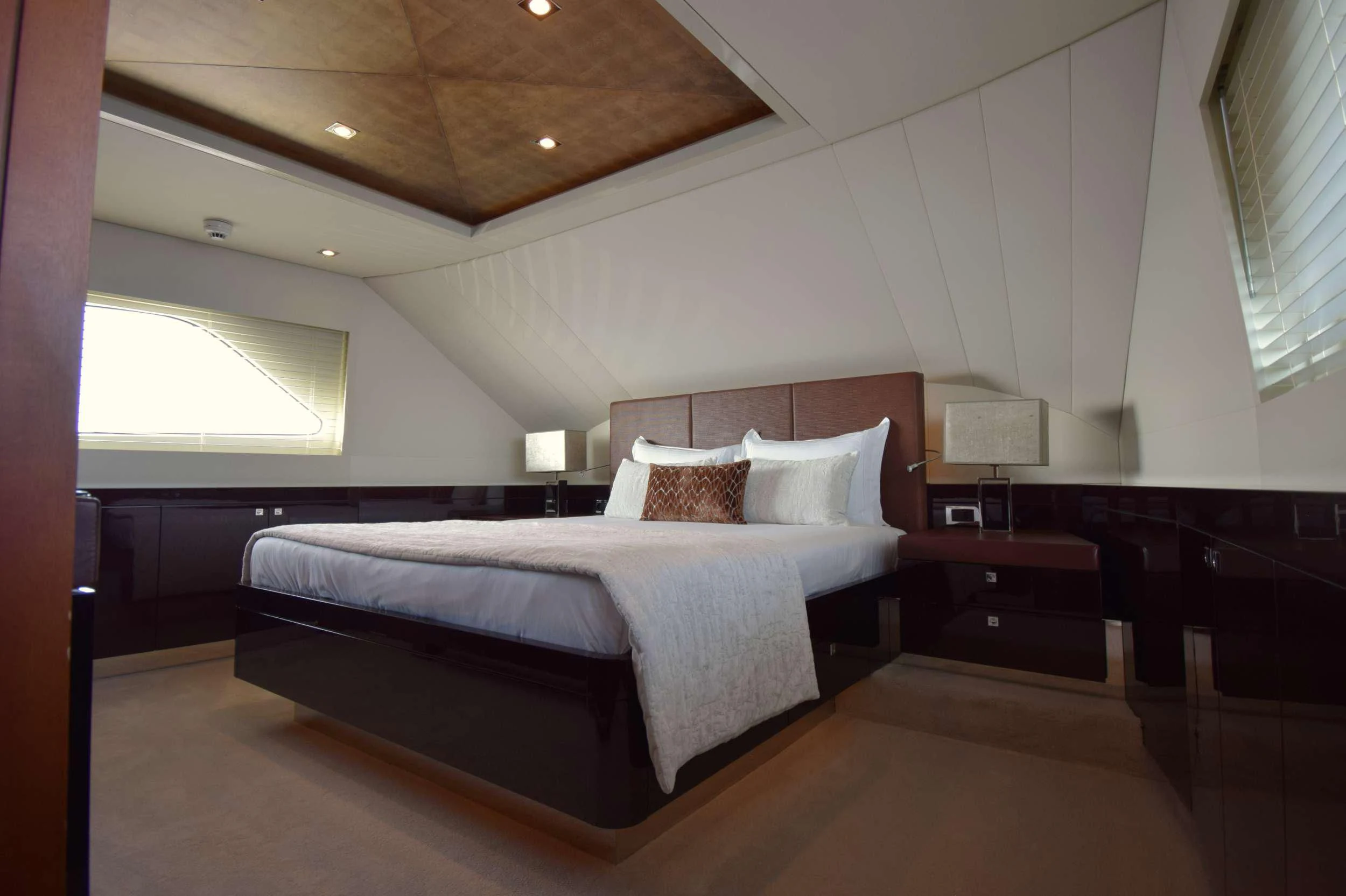 a large bed in a room aboard ORIZZONTE Yacht for Sale