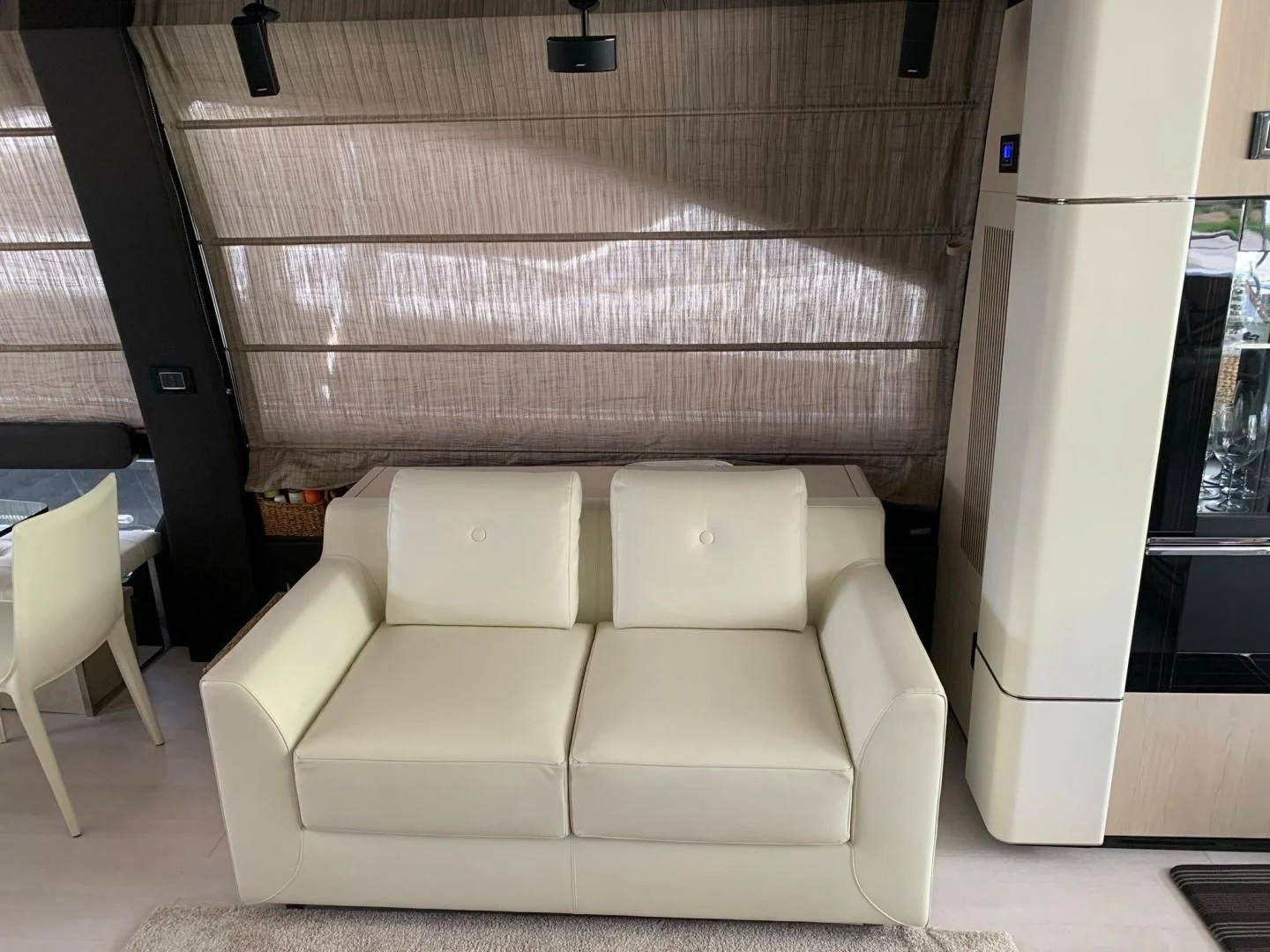 a white couch in a room aboard AMALFI Yacht for Sale