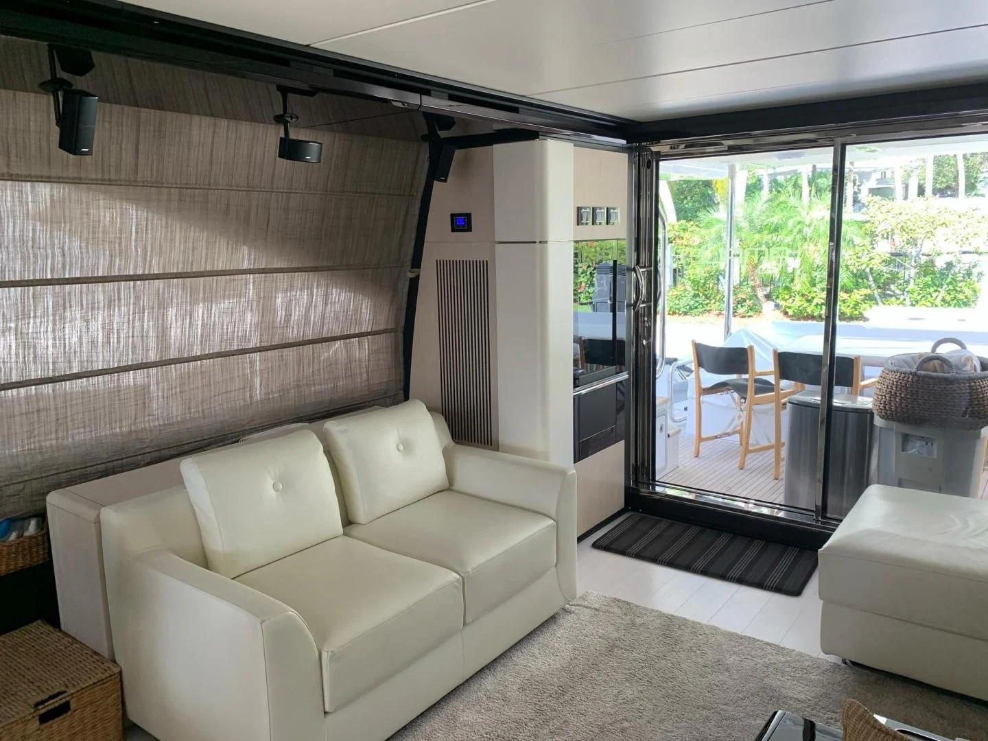 a living room with a sliding glass door aboard AMALFI Yacht for Sale