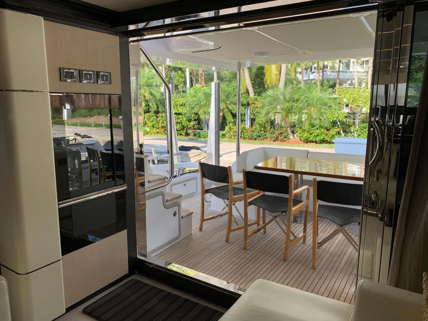 a room with a table and chairs aboard AMALFI Yacht for Sale