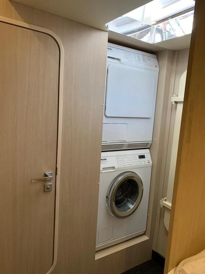 a closet with a washing machine aboard AMALFI Yacht for Sale