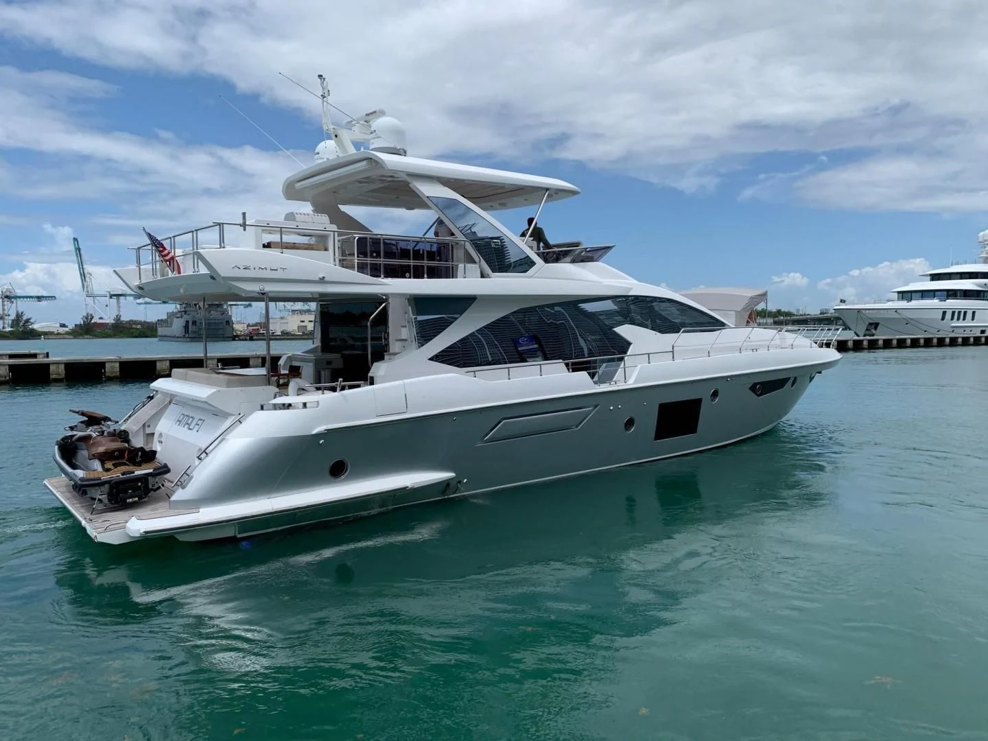 a white yacht in the water aboard AMALFI Yacht for Sale