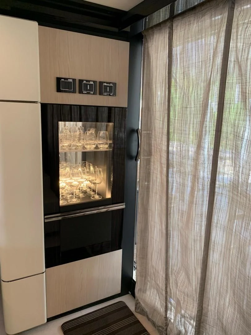 a room with a fireplace aboard AMALFI Yacht for Sale
