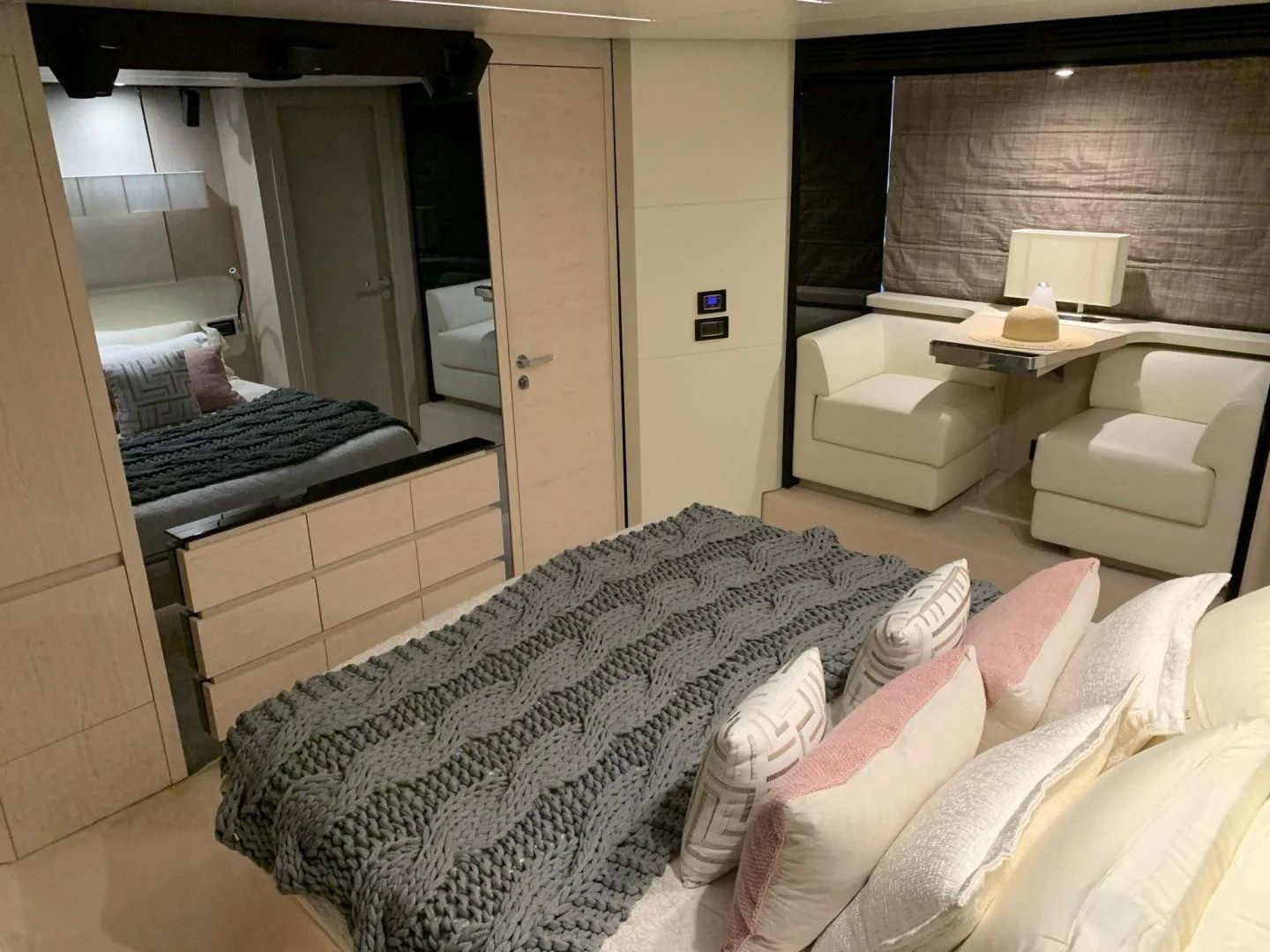 a bedroom with a bed and a desk aboard AMALFI Yacht for Sale